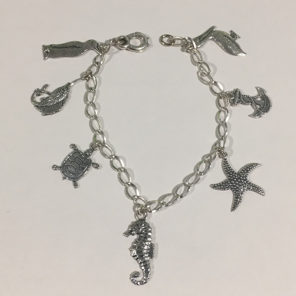 Sterling Silver Bracelet With 7 Different Charms - Picture 1 of 7